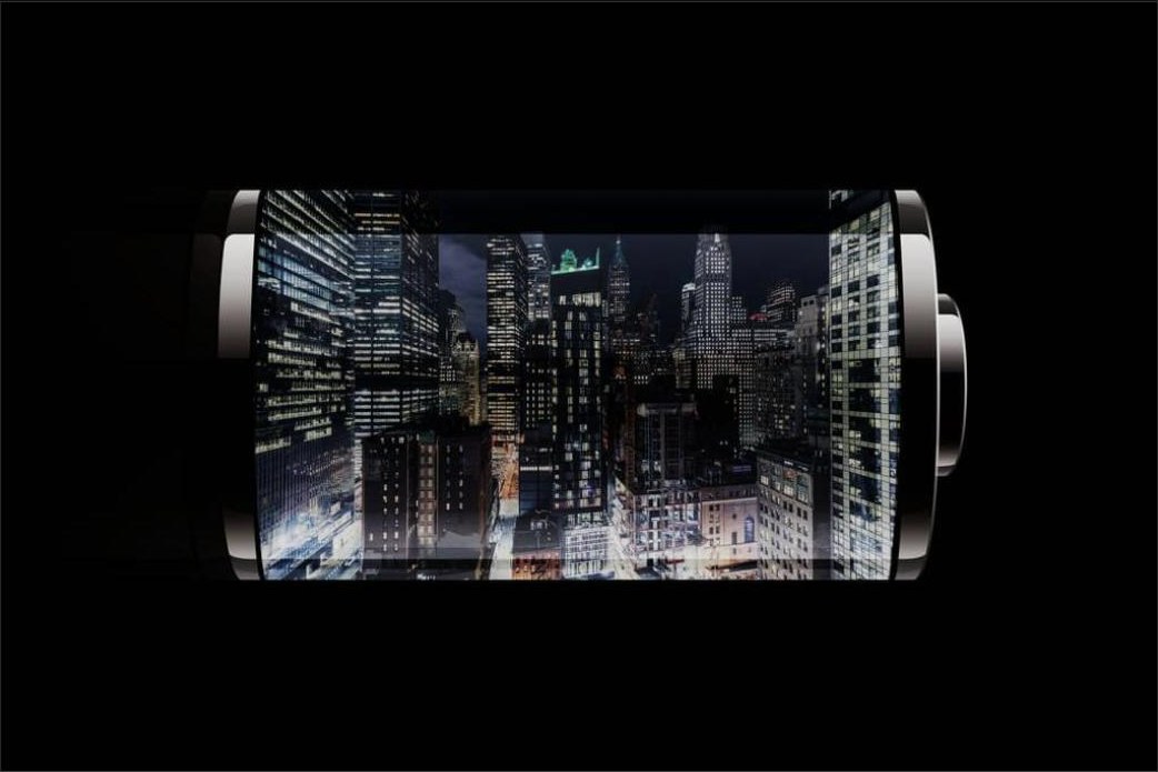Illustration of a battery containing a city skyline