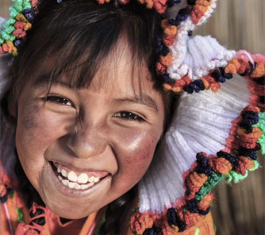Smiling girl in traditional Bolivian dress