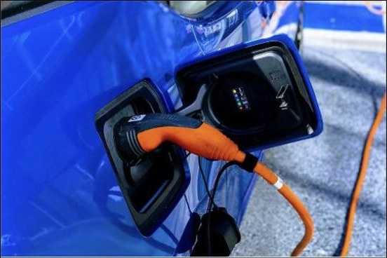 Electric car being charged