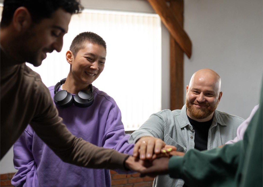 Team members joining hands